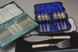 A pair of Epns ivorine handled fish servers, a set of six Continental white metal teaspoons and