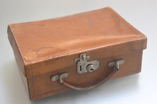 A small leather case with original handle etc. (h.10cm x27cm x 20cm)