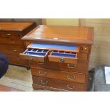 An Eastern hardwood chest, the rectangular top with moulded edge above a pull out leather slide,