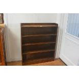 A 1920's upright open bookcase with ledge back and fitted with five shelves. 108cm by 91.5cm by