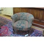 A neat 19thc. scroll back nursing style chair with tapestry upholstery, on scroll supports (h.60cm)