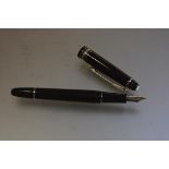 A Mont Blanc Meisterstuck platinum trim fountain pen with engraved inscription