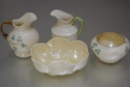A collection of Irish Belleek porcelain including a shell shaped scalloped dish with green back