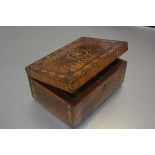 A 19thc walnut parquetry inlaid sewing box, the rectangular top with star shaped inlay, enclosed