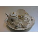 A Gray's Pottery breakfast cabaret set including cup, fitted saucer, toastrack, milk jug, sugar