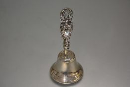 An Epns bell with earlier Birmingham silver chased and pierced rose and C scroll handle, complete