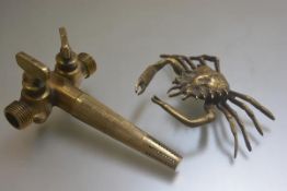 A brass cast model of a crab (20cm) and a brass tap (l.21cm) (2)