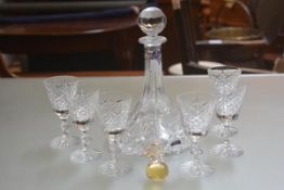 An Edinburgh Crystal ship's port decanter (h.29cm) and set of six crystal slice cut port glasses (