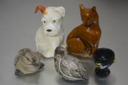 A Beswick terrier pottery figure with brown ear (h.15cm), a pottery moulded cat figure, a Poole