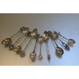 Ten various silver and white metal souvenir teaspoons including Canada, Keswick, etc.