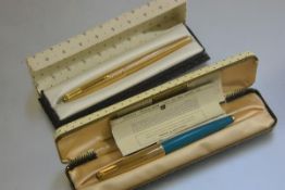 A pre 1975 Parker 61 Consort Insignia boxed fountain pen, a turquoise Parker 61 in clam shell box
