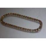 A 9ct gold fancy gatelink style necklace (l.17cm) (34.54g)