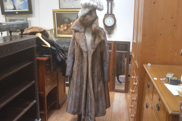 A lady's ranch mink full length jacket (l.113cm) and three various mink hats including a winter
