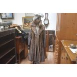 A lady's ranch mink full length jacket (l.113cm) and three various mink hats including a winter