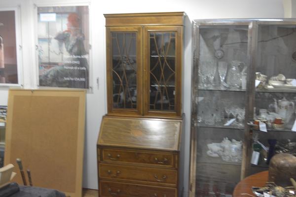 An Edwardian two part mahogany satinwood inlaid bureau bookcase, the moulded cornice above a pair of