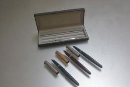 Two Parker 51 fountain pens with stainless steel tops and a Parker 51 with gilt metal top (3)