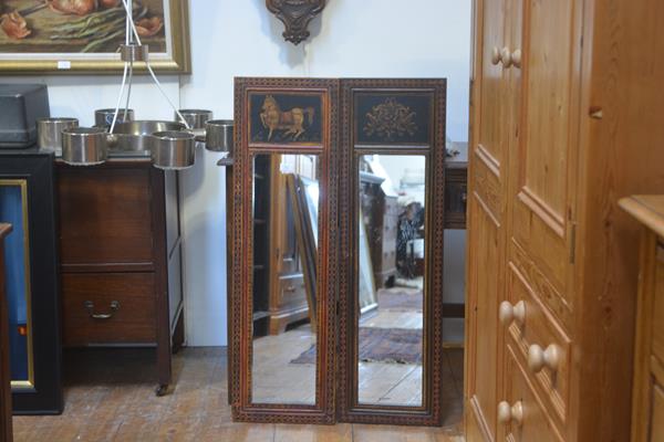 A pair of modern painted wood rectangular panelled mirrors with decorative floral enamelled and