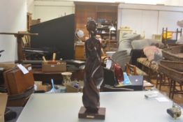 A Caoba treen carved female figure statue, raised on moulded base (h.65cm. base: 17cm x 12cm)