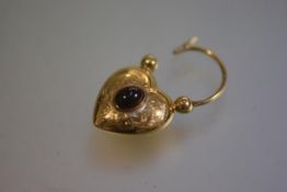 A Birmingham 9carat gold Victorian style engraved heart shaped padlock with garnet cabouchon to