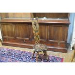 An Edwardian pokerwork fern decorated pierced heart shaped panel back and seat chair, raised on ring