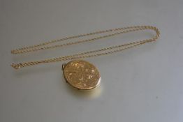 A 9ct gold trace link chain with a 9ct gold engraved oval locket, inscribed verso: l.30cm (4.75g)