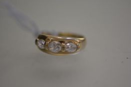 A 14ct gold dress ring mounted three graduated cubic zirconia stones (U) (6.2g)