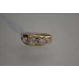 A 14ct gold dress ring mounted three graduated cubic zirconia stones (U) (6.2g)