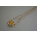 A George V gold sovereign 1913 mounted in 9ct gold wirework open frame on 9ct gold tracelink chain