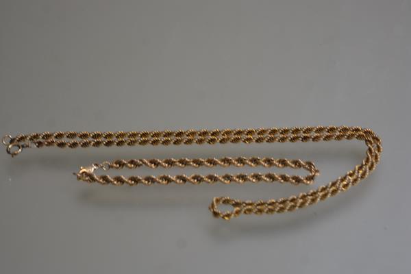 A yellow metal rope pattern chain with similar bracelet (chain:25cm. bracelet: 10.5cm) (16.69g)