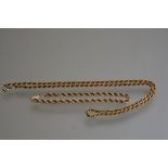 A yellow metal rope pattern chain with similar bracelet (chain:25cm. bracelet: 10.5cm) (16.69g)