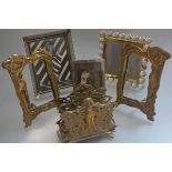An Art Nouveau style brass two division letter rack of female form design, a pair of brass Art