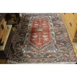 A Milas style Turkish rug, the centre diamond panel with stylised lotus flowers enclosed within a