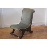 A 19thc ebonised brass mounted child's scroll back chair, upholstered in draylon, raised on scroll