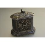 A Victorian Epns dome top hinged biscuit barrel with seated hound and chased cherub and Bacchus mask