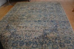 A Kerman carpet, the centre medallion enclosed within scalloped lotus flower, leaf and lattice, with