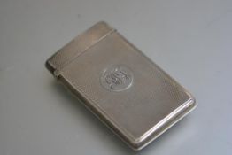 A Victorian silver engine turned decorated card case with engraved cypher, London 1897 (42.1g)