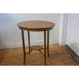 An Edwardian mahogany oval inlaid two tier occasional table, raised on square tapered supports (71cm