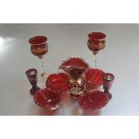 A collection of ruby Murano glass including two white wine glasses with gilded and floral