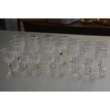 A set of seven crystal port glasses, a set of six sherry glasses, a set of six sherry glasses and