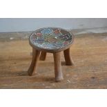 A Nigerian hardwood carved stool with inset beaded top (h.18cm x 21cm)