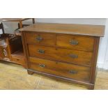 An Edwardian walnut chest, the rectangular top with moulded edge above two short and two long