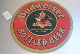 A metal stamped Budwieser Bottled Beer enamelled sign (d.51cm)