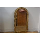 A 1950s gilt scrolling leaf openwork bordered arched wall mirror with bevelled glass plate (86cm x