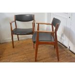 A pair of 1960s teak vinyl upholstered curved panel back and seat open armchairs (one seat
