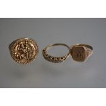 A 9ct gold signet ring, a 9ct gold seven stone eternity style ring and a 9ct gold St Christopher