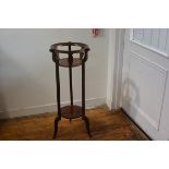 An Edwardian mahogany satinwood and boxwood strung inlaid two tier jardiniere stand, the circular