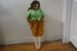 A 1920s composition articulated doll, Gerda, with inset eyes, painted face and cotton hair with