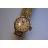 A lady's Rotary 21 jewel 9ct gold cased wristwatch with champagne dial and lozenge hour markers on