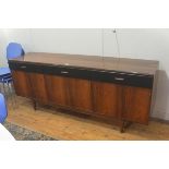 A Beresford & Hicks 1960s rosewood longjohn style sideboard, fitted three vinyl fronted drawers