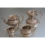An Edwardian four piece Epns tea and coffee service with chased floral decoration (coffee pot:
